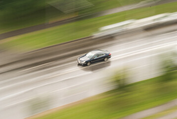 Fototapeta na wymiar Fast moving car