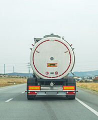 Fuel transport truck in traffic. No logo or brand. The transport industry and that of petroleum...