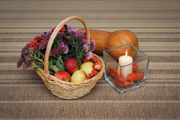 Basket of autumn gifts on the floor