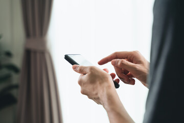 Closeup of happy man using a smartphone , searching, browsing, social media, message, email, internet digital marketing, online shopping..