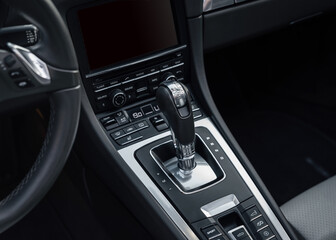 Obraz na płótnie Canvas Automatic gear parked inside modern vehicle sports car automobile. Automatic gearbox shifter