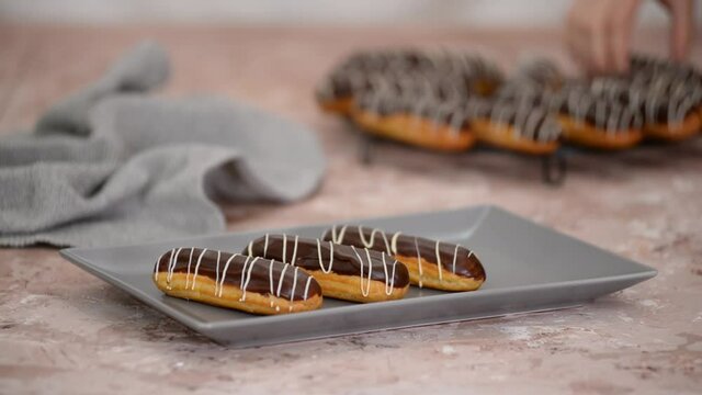 French dessert eclair with chocolate and custard. Traditional French dessert.