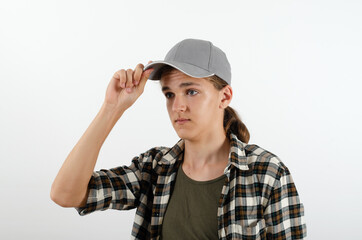 Young man touching his cap