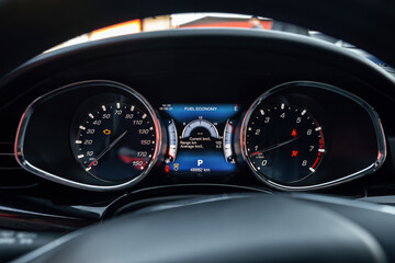 Night time dashboard of modern car. Screen display of car status warning light on dashboard panel...
