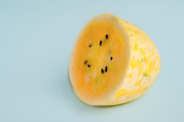 Exotic yellow watermelon on a blue background