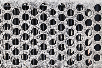 Perforated metal background. Grunge background of old iron with holes.