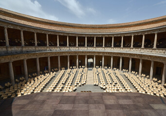 Stage with chairs in the round courtyard of a Muslim palace with columns in the open air