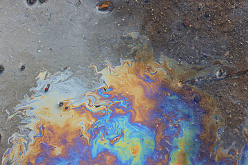 spilled gasoline rainbow background, industrial hazard spill pollution, abstract texture multicolored