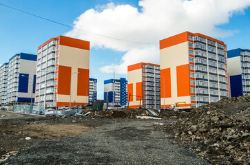 New apartment buildings. New residential area. Housing estate. Modern architecture. Blue sky....
