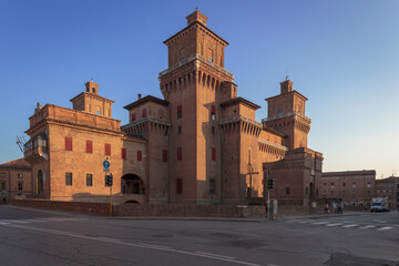 Fototapeta na wymiar Ferrara. Lato posteriore del Castello Estense al tramonto.