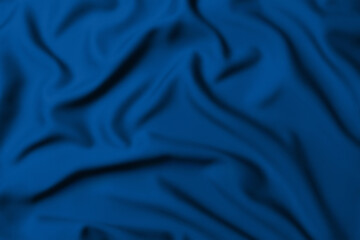 Blue crumpled fabric background. Draped textile design.