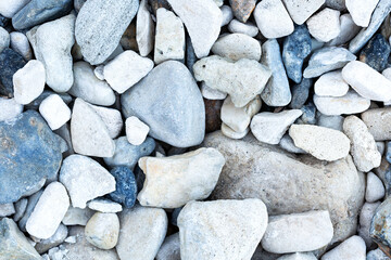 White and gray stones by the sea. Natural background
