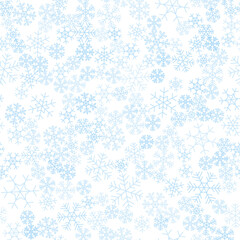 Seamless winter background consisting of snowflakes of different shapes. White background and blue snowflakes.Christmas and new year symbol and mood.
