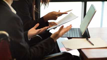 Two businessman and businesswoman or lawyer discussing works in office