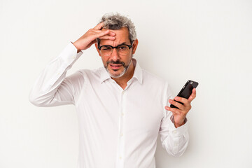 Middle age caucasian business man holding a mobile phone isolated on white background  being...