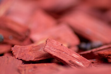 Shredded red wood chips fragments as red woodpath with timber shavings and recycled and renewable...