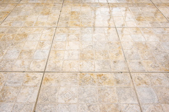 Old ceramic tile floor closeup