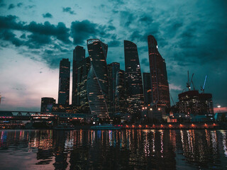 Night photo of skyscrapers of Moscow City international business centre. View from river