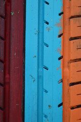 car tire painted red, blue and orange