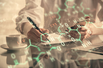 Double exposure of formulas sketch hologram and woman holding and using a mobile device. Education...