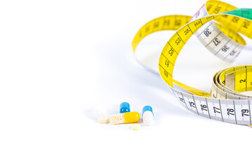 Various tablets with a tape measure isolated on white and copy space
