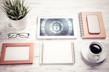 Web security and technology concept with tablet pc on wooden table