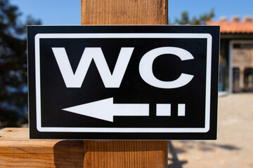 WC sign, logo of public toilet in the street