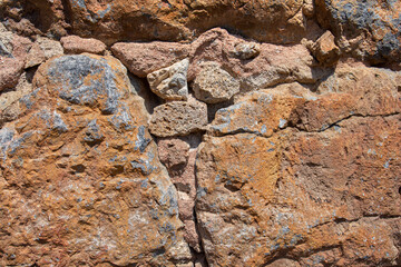 Texture of a stone wall. Old antique stone wall texture background.