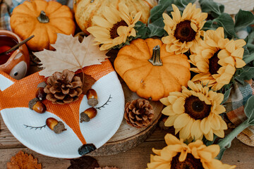 Autumn composition with dried leaves, pumpkins on wooden background. Autumn, fall, halloween, thanksgiving day concept. Flat lay, top view, copy space. Autumn still life