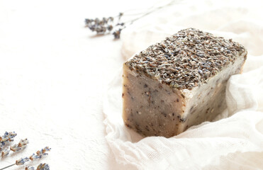 Handmade soap with lavender on a white tablecloth