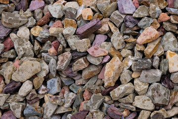 Beautiful decorative colored gravel in the rain. Natural small stones for design in Germany.