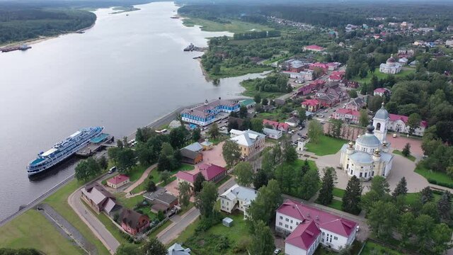 Aerial panoramic view of Russian town of Myshkin on banks of Volga River on summer day overlooking Assumption Cathedral and Nikolskaya church, Yaroslavl Oblast