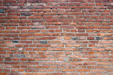 Naklejka premium Old red brick wall - horizontal photograph