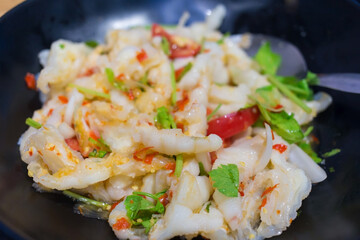 Chicken feet spicy salad is a Thai style food. It’s mixed boiled chicken feet, chopped Thai celery, tomato, onion and chili.