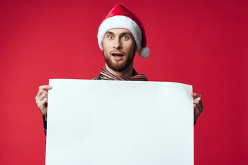 emotional man in New Year's clothes advertising copy space red background