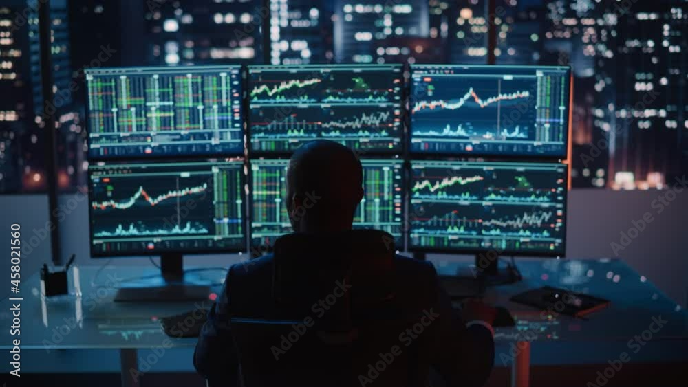 Poster hedge fund trader working on a computer with multi-monitor workstation with real-time stocks, commod