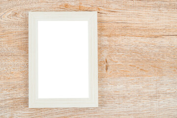 Picture frame on wooden wall texture background