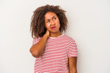 Young african american woman with curly hair isolated on white background having a neck pain due to stress, massaging and touching it with hand.