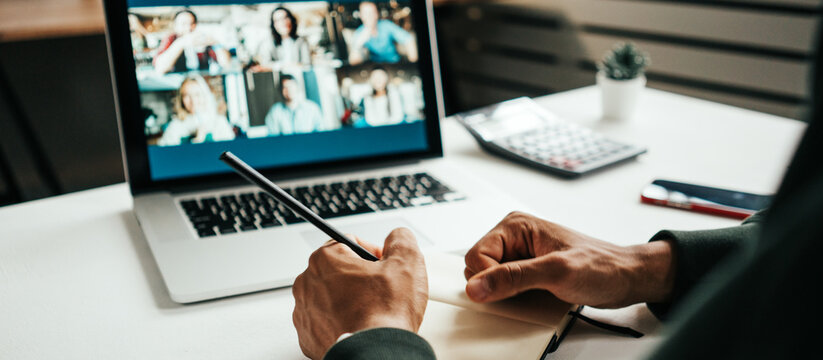 Young Black Man Has Video Conference Call. Remote Meeting Using Laptop. Hands Close-up