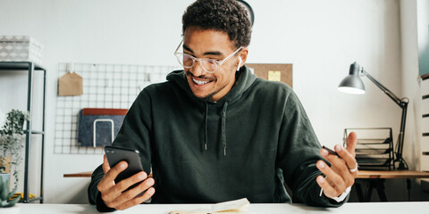 Mobile stock application. Young black man finance trading. Successful day