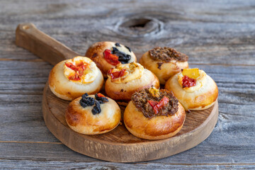 tiny delicious pizzas on wood floor