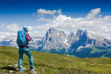 Hiker woman enjoying the views over The Dolomites in italy