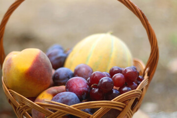 Vintage basket filled with various fruit. Selective focus.