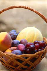 Vintage basket filled with various fruit. Selective focus.