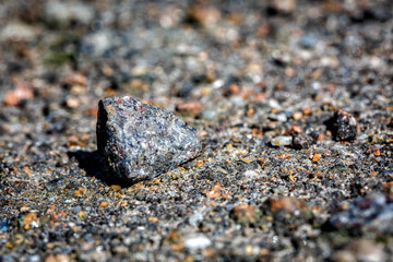 small stones are pressed into the asphalt