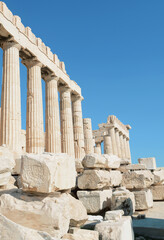 the immensity of the colonnade of the Parthenon on the rocac of the acropolis in the blue Mediterranean sky