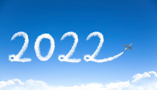 happy New year 2022 concept. cloud drawing by airplane in sky