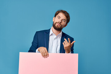 Cheerful man pink paper in the hands of marketing fun Lifestyle isolated background