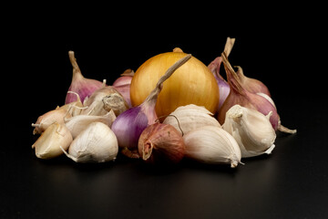 Whole group pile ingredient of fresh onion garlic group isolated on black background