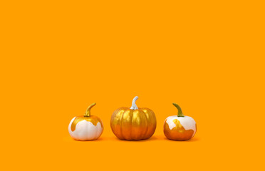 Autumn minimal concept. Three golden pumpkins in row on orange background. Halloween, Thanksgiving or fall creative  sale concept. Copyspace.